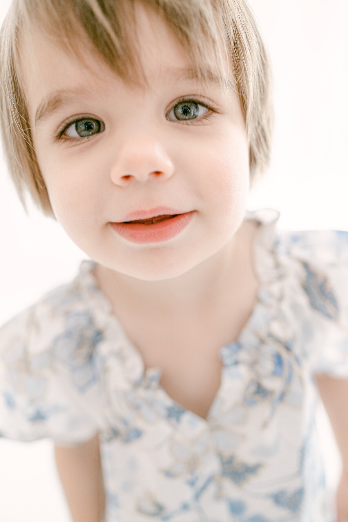 Toddler looking at the camera blue eyes