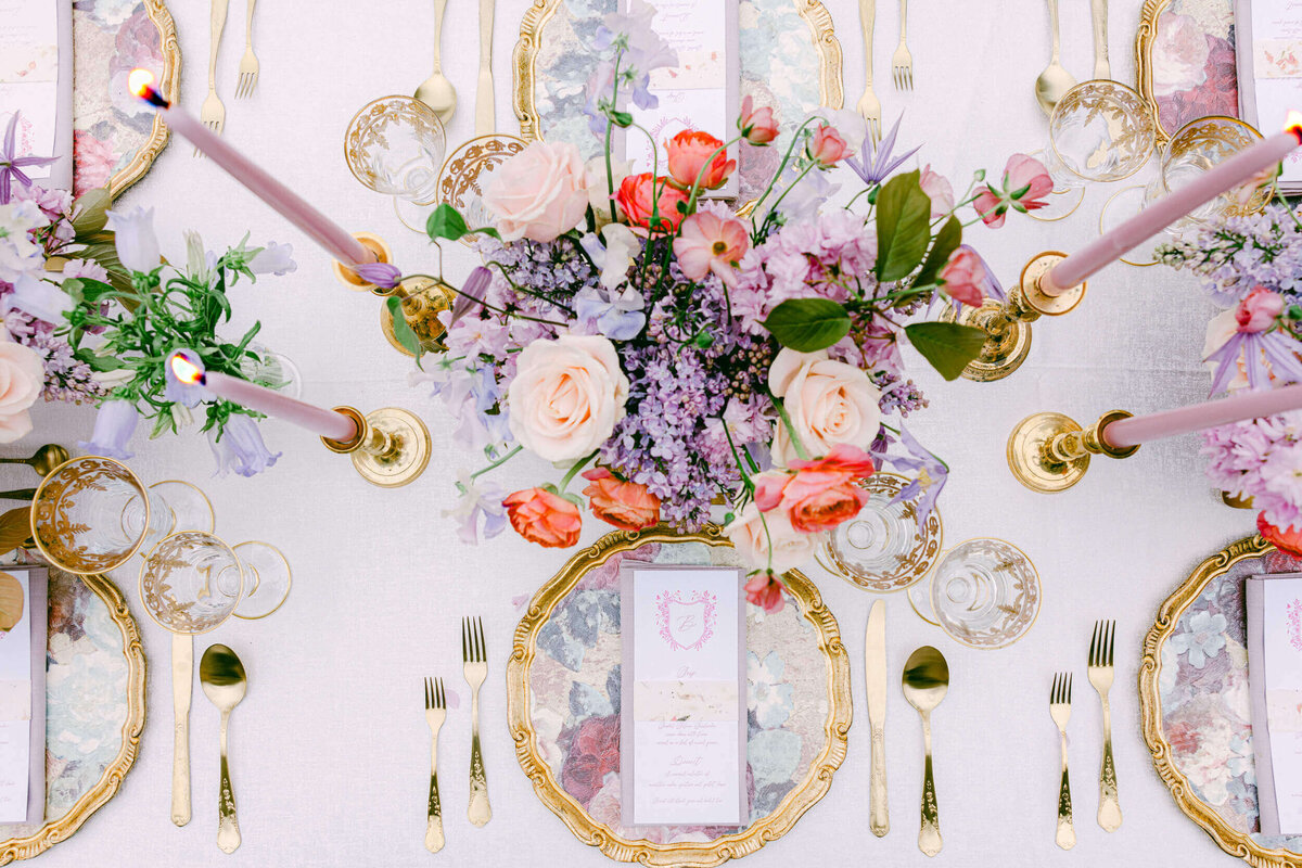A wedding day photo of the table scape on the reception dinner table at Hedsor House in the UK