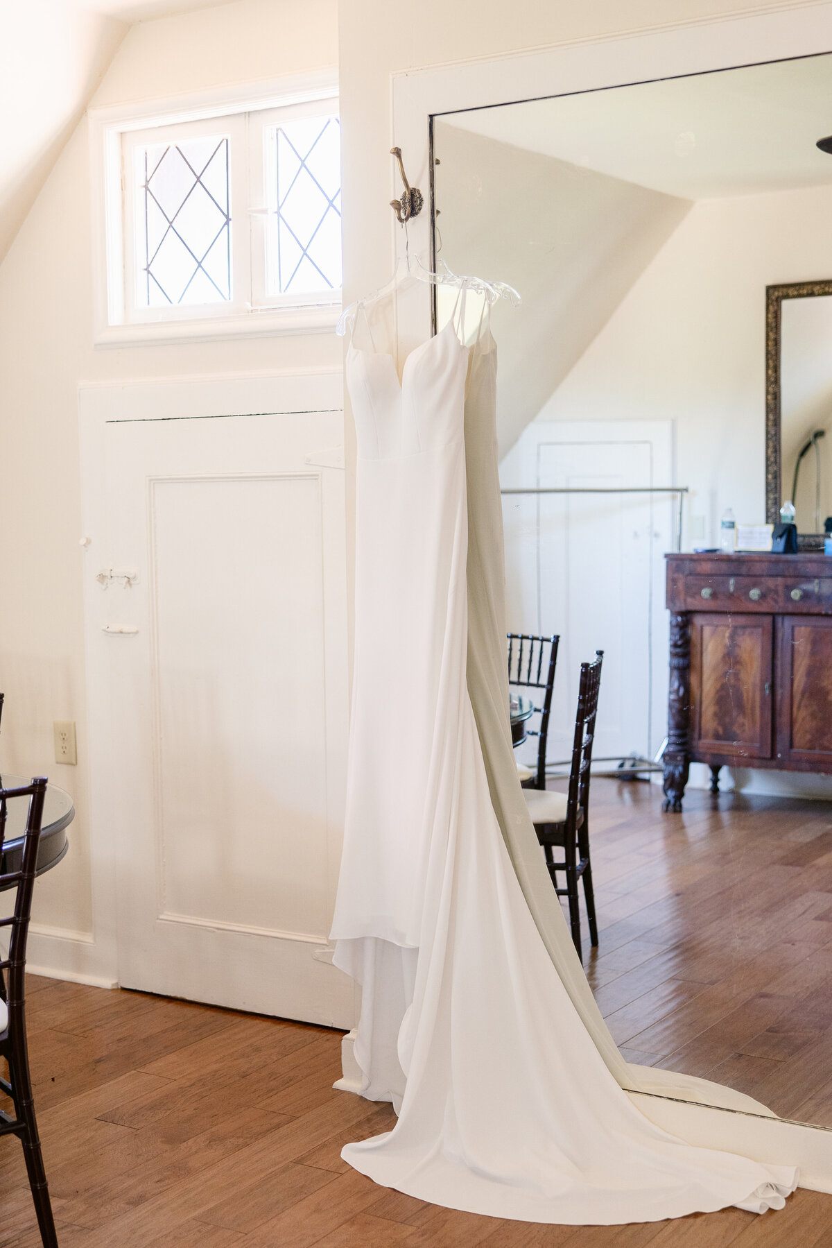 wedding-dress-hanging-in-bridal-suite-saint-clements-castle