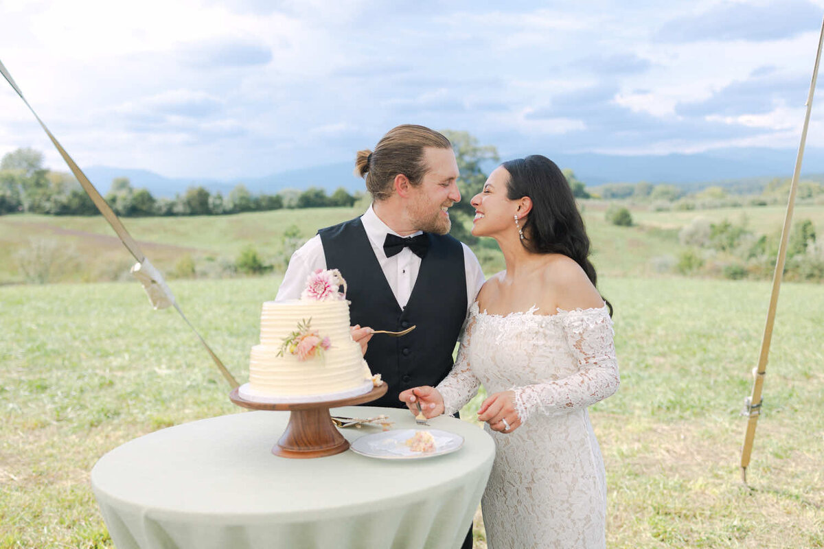 Couple cutting their wedding cake at an outdoor reception in Virginia.