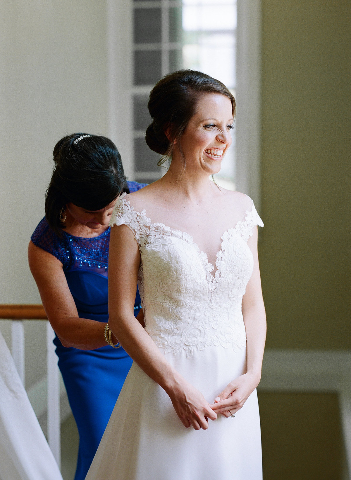 Joyful Bride getting into Gown in Athens, GA