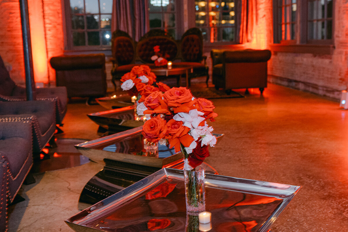 Moody floral styling in cocktail lounge area of editorial firehouse wedding