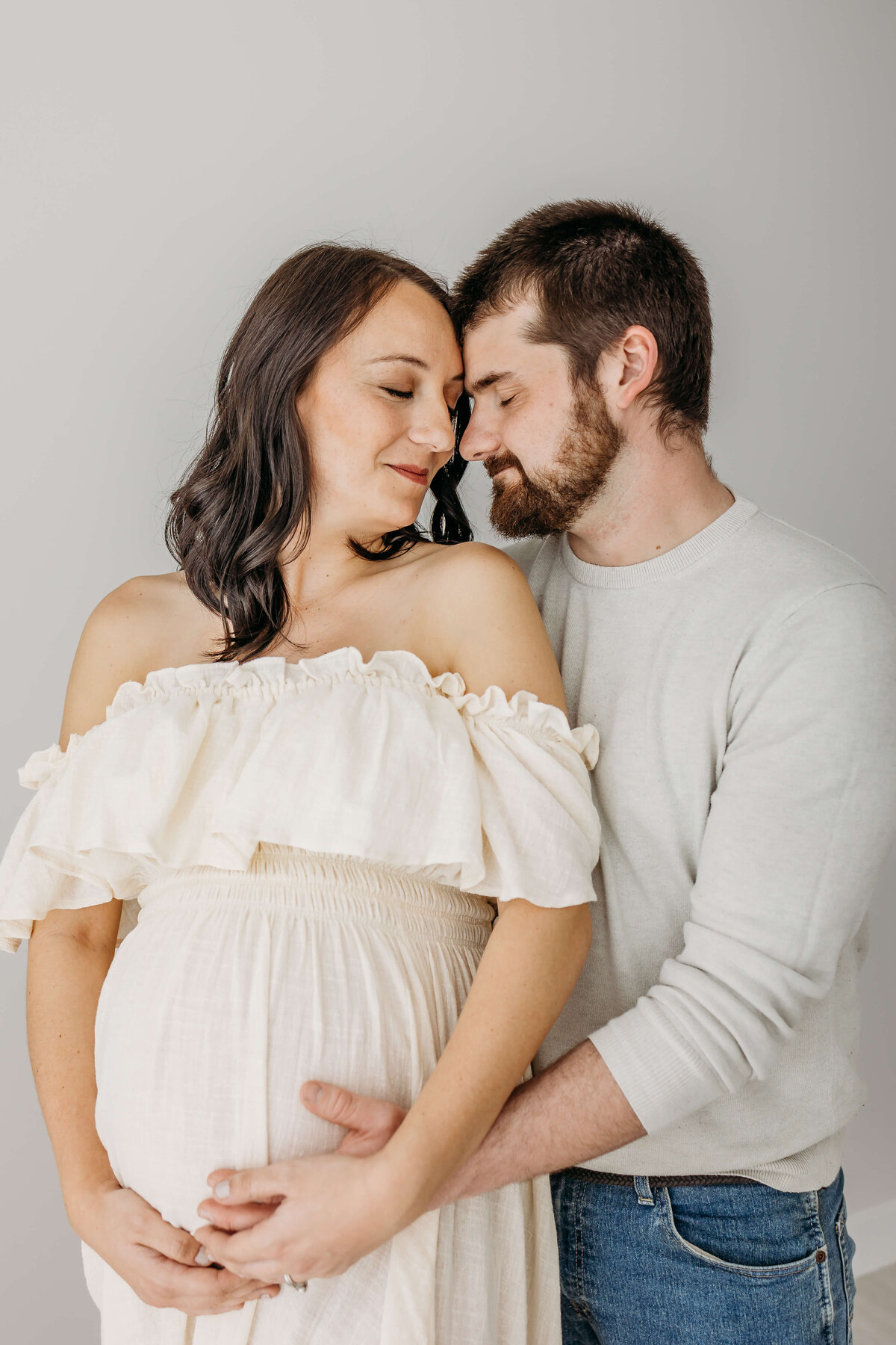 Couple in love expecting baby for maternity pictures