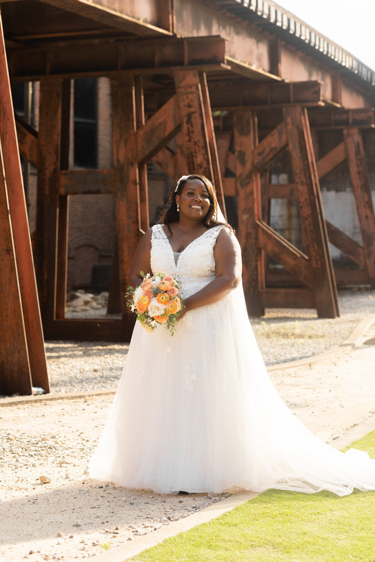 black bride holding bouquet at Columbus Trade and Convention Center in Columbus Georgia by Amanda Richardson Photography