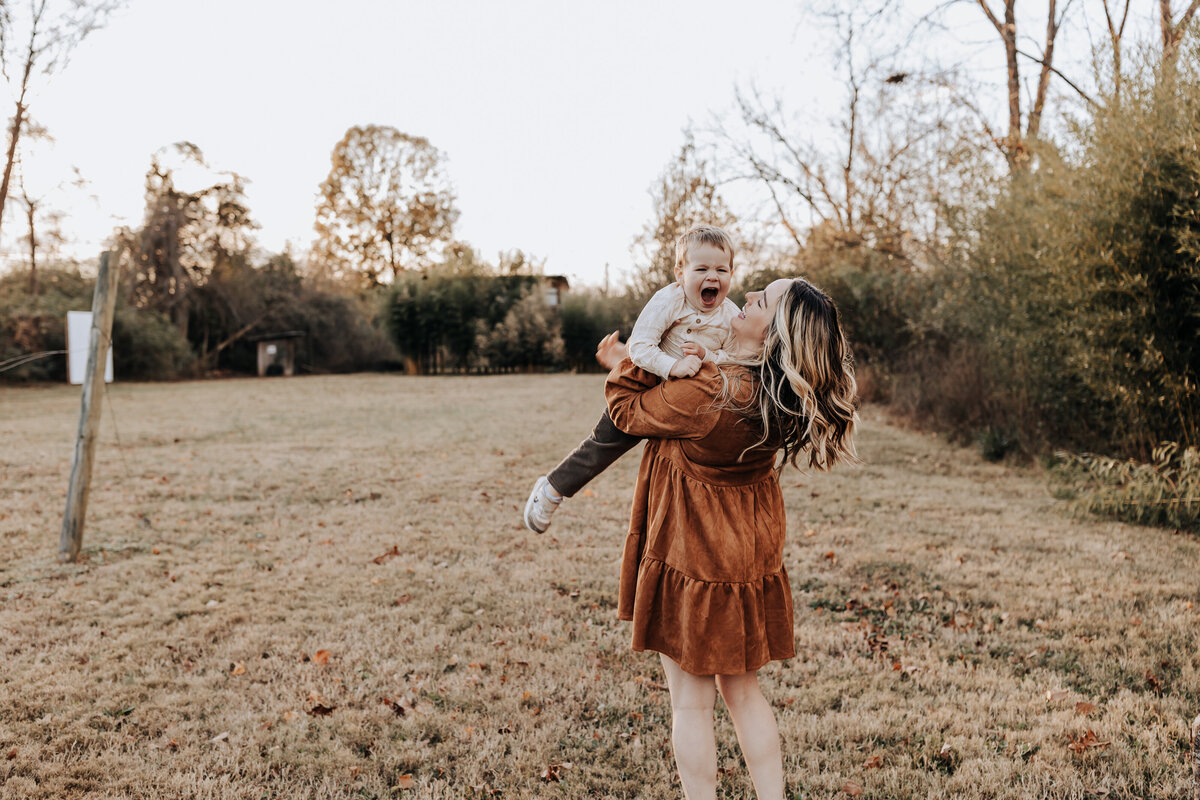 Nashville family photographers capture mother playing with child outdoors