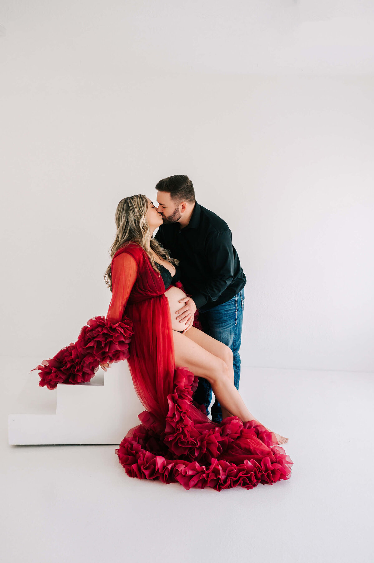 pregnant couple kissing  during Joplin MO maternity photography session