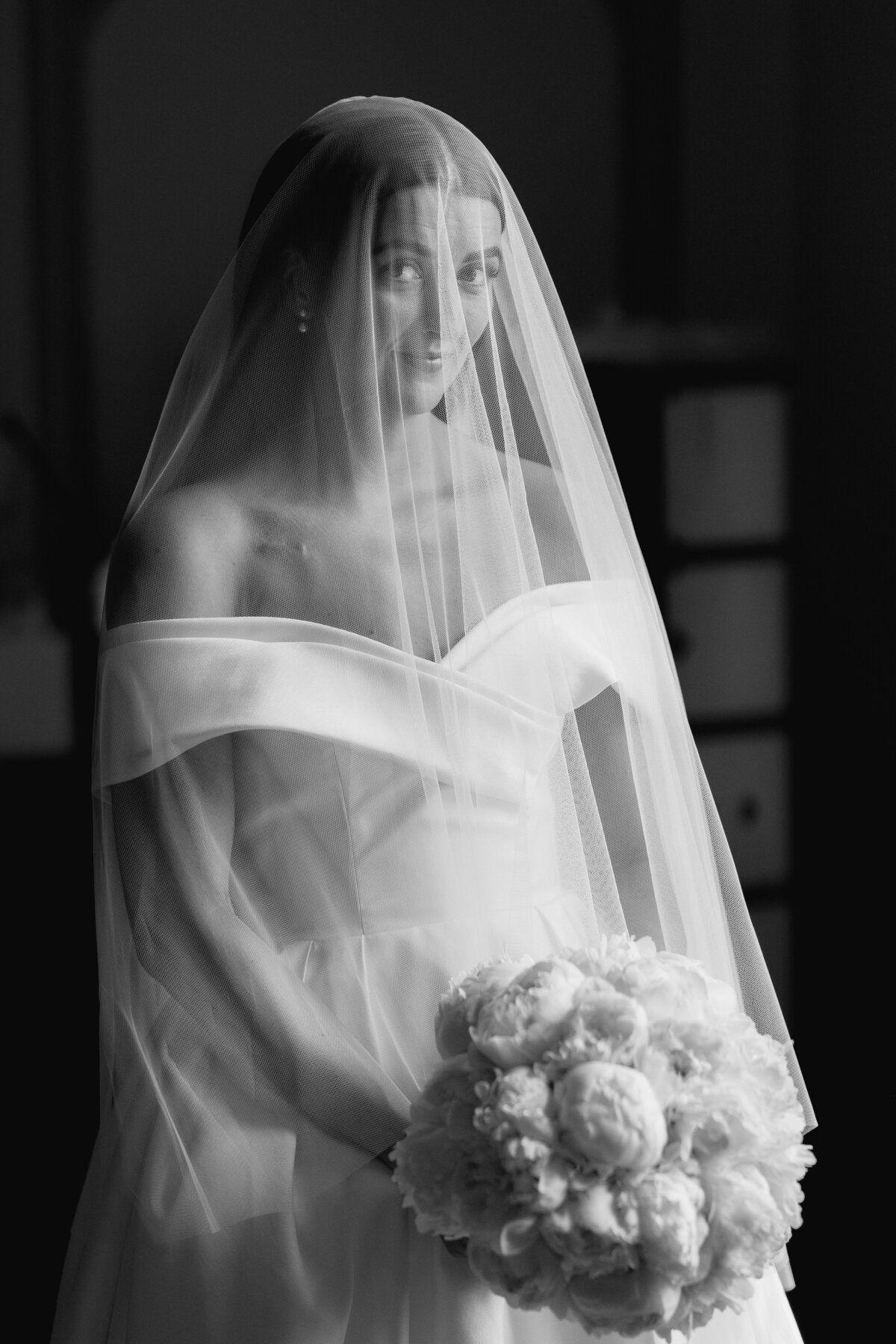 Black and white editorial portrait of the bride