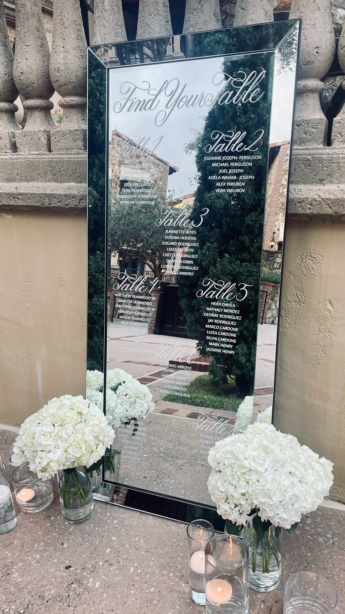Large beveled mirror with calligraphy for seating chart