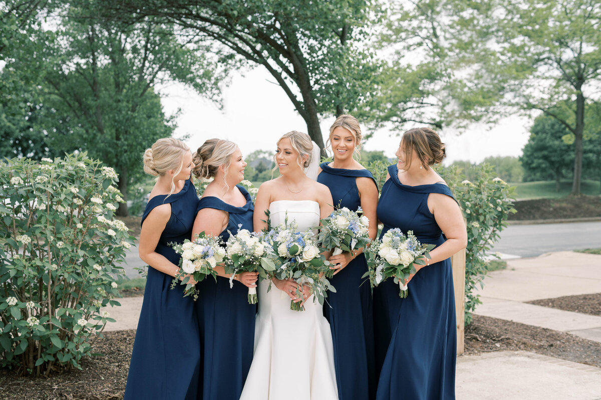 bride and her bridesmaids in navy blue