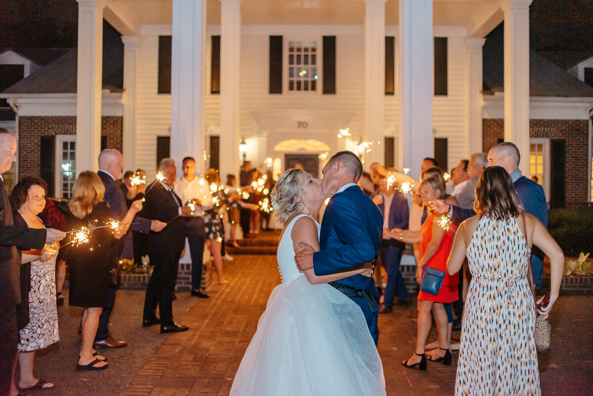 couple kissing during their exit in myrtle beach, sc