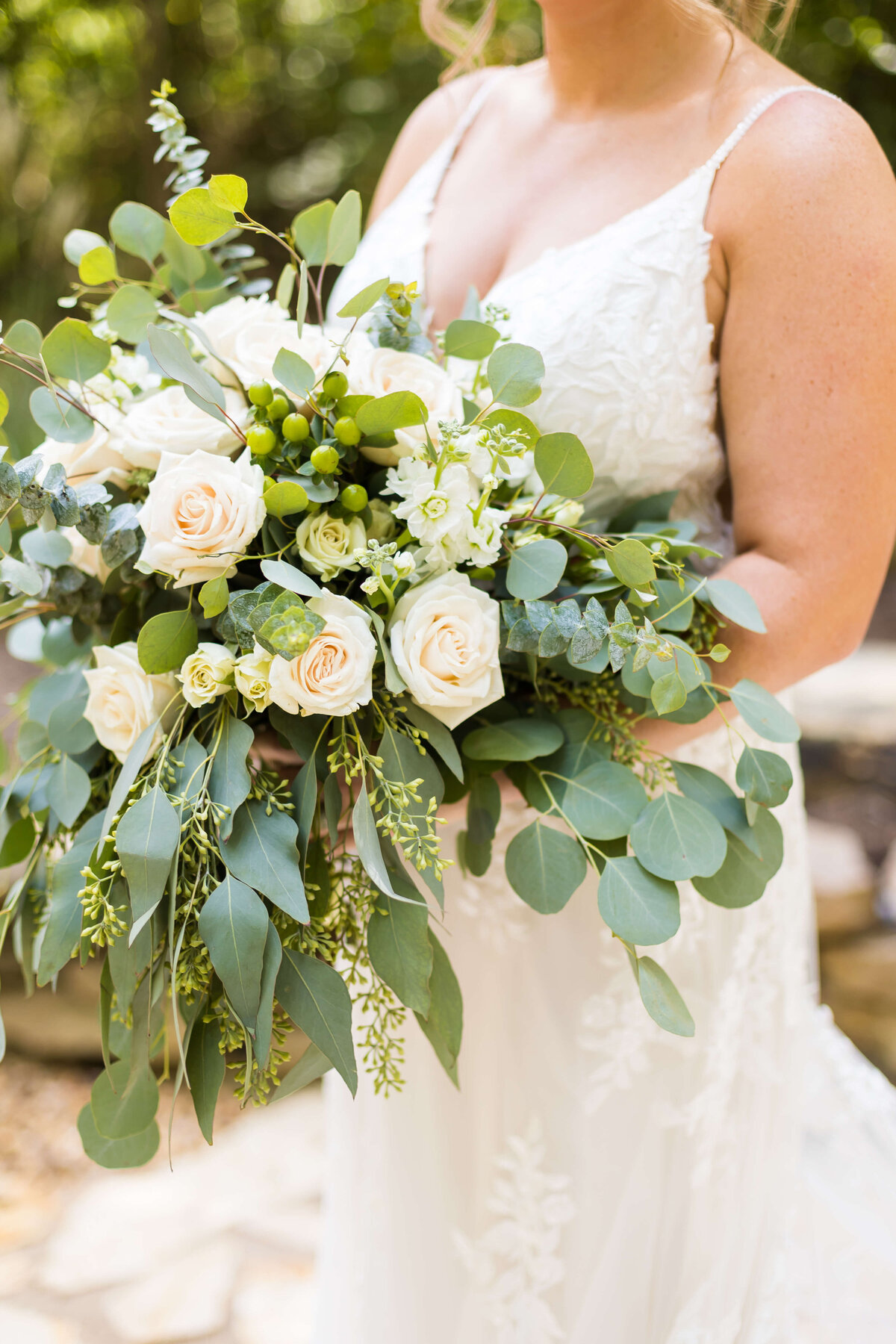 Bride holding bouquet at  The Barn at White Oaks, Murray, Kentucky