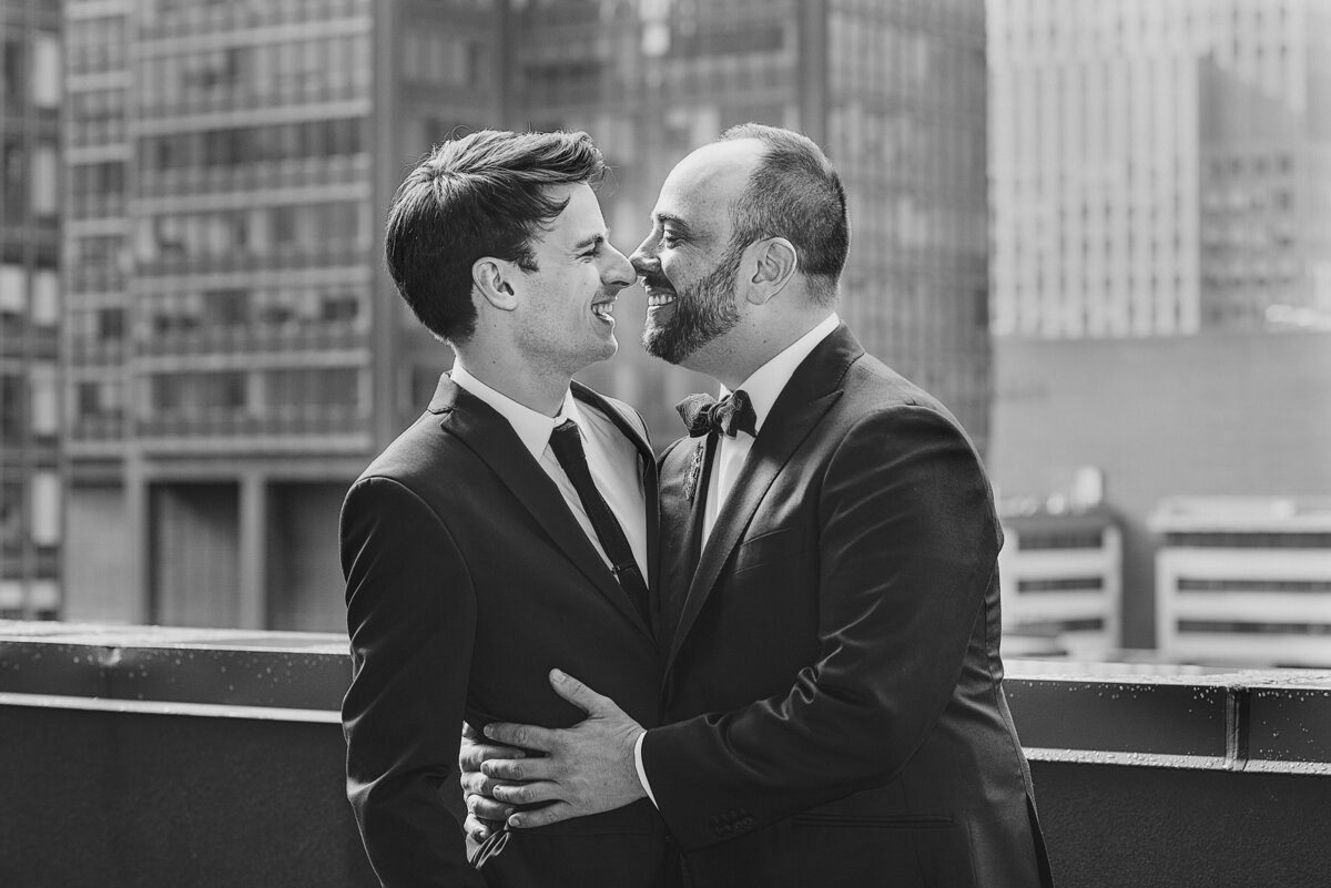 A couple about to kiss on a rooftop