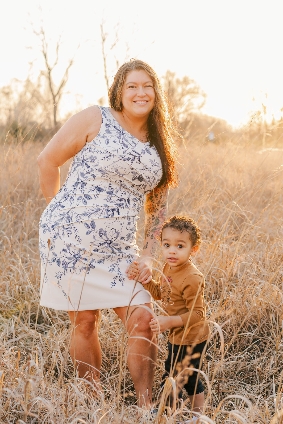 Grandmother and grandson at golden hour in field at Old Fort Park in Murfreesboro Tennessee