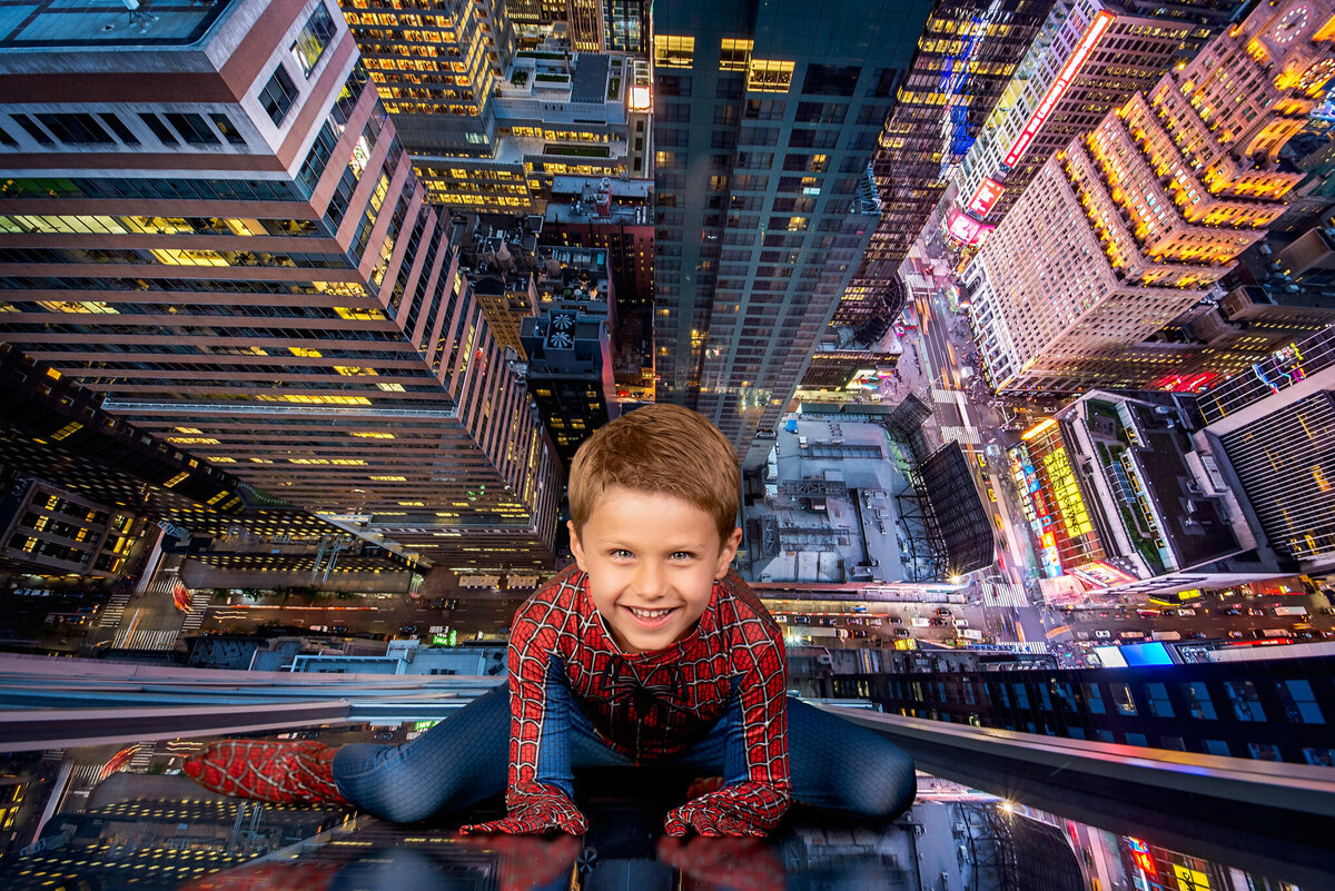 Dramatic fine art portrait of a young child dressed as a superhero, posed against a vibrant urban cityscape at night. Captured in Overland Park, Kansas, this dynamic setup is perfect for families seeking bold and creative child photography