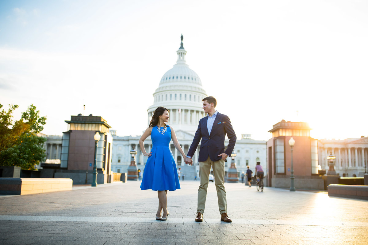 A couple stands in front of the state capital.
