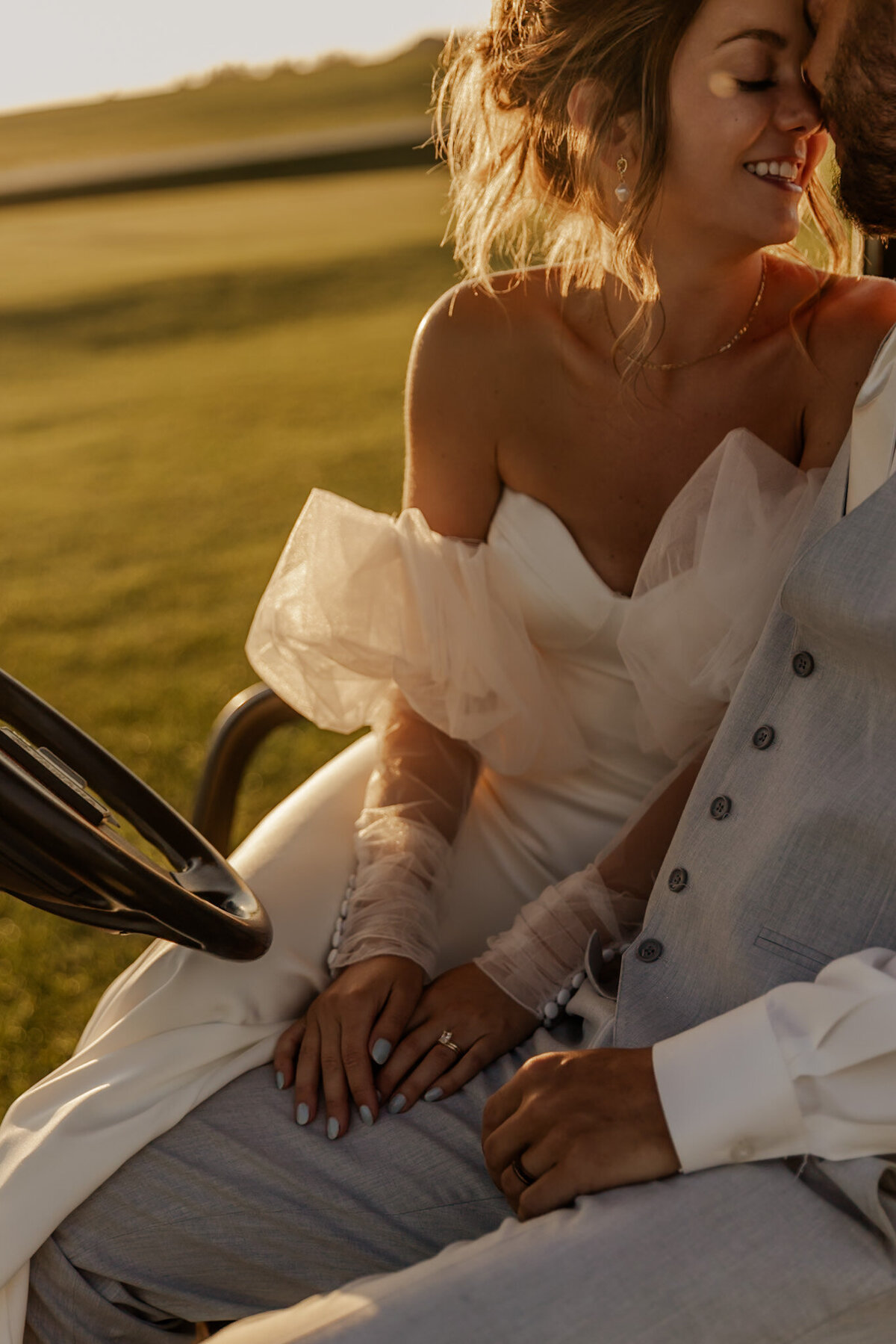 Bride and Groom holding each other on a golf cart in Caledonia, MN 