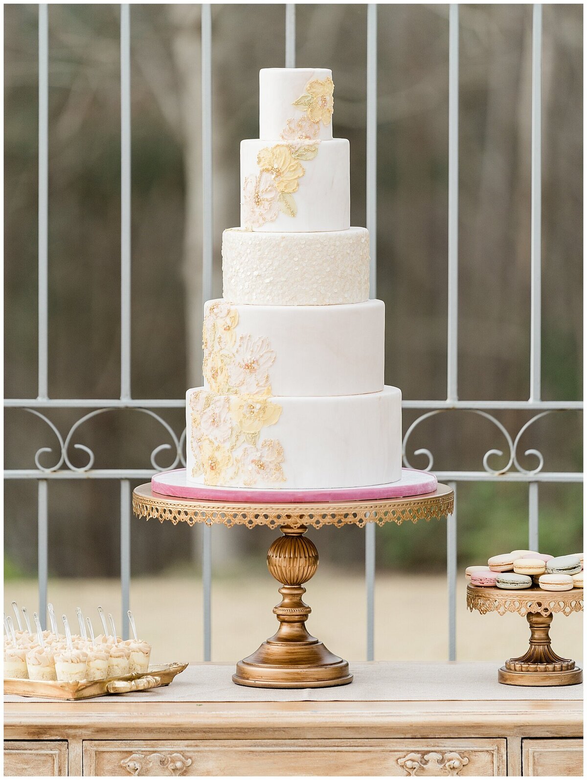 White wedding cake with yellow decor