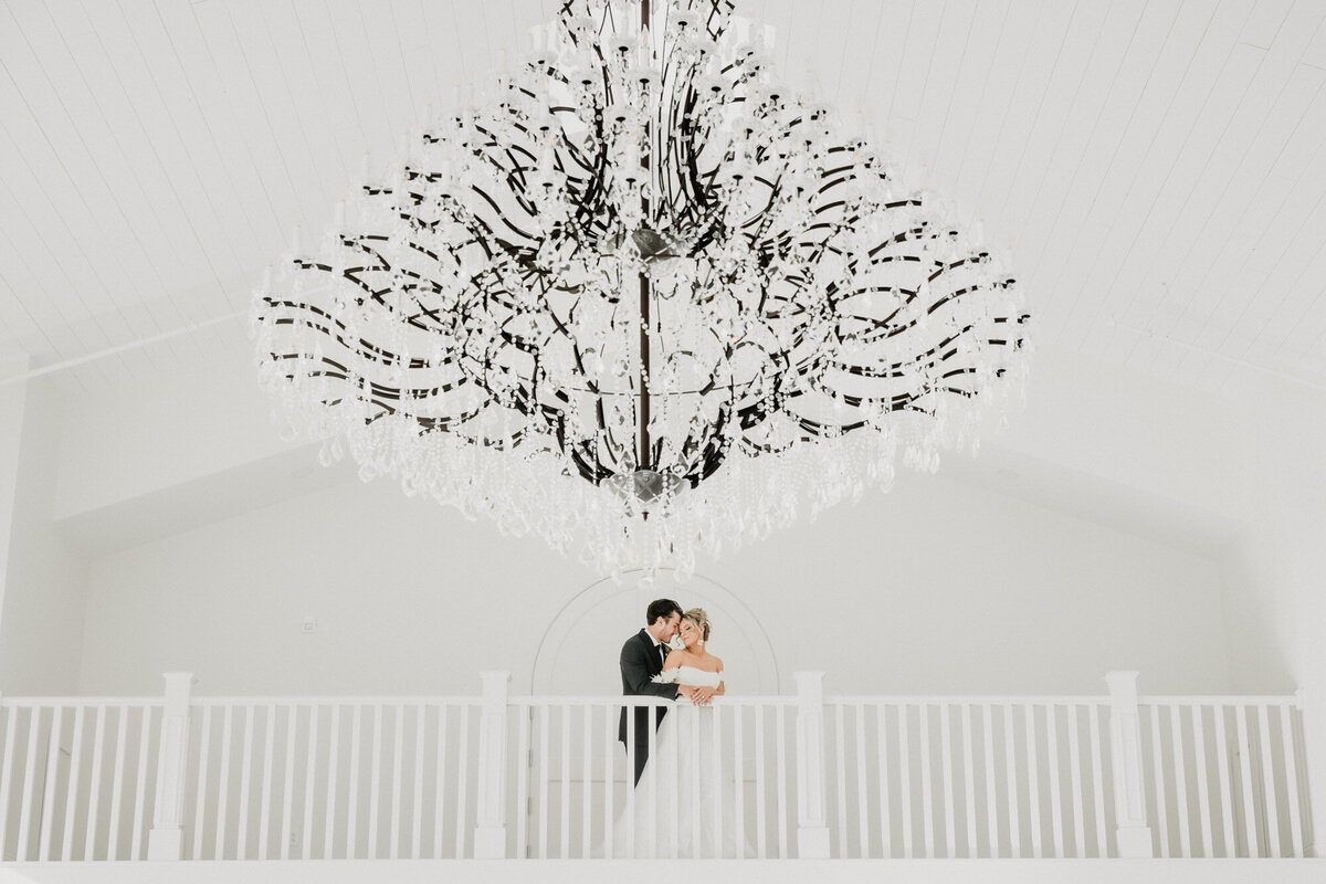 Bride and groom embrace at the Westwind Hills wedding venue in Pacific, Missouri.