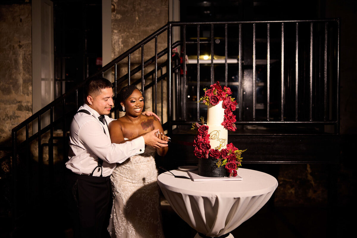 Wedding couple about to slice their wedding cake