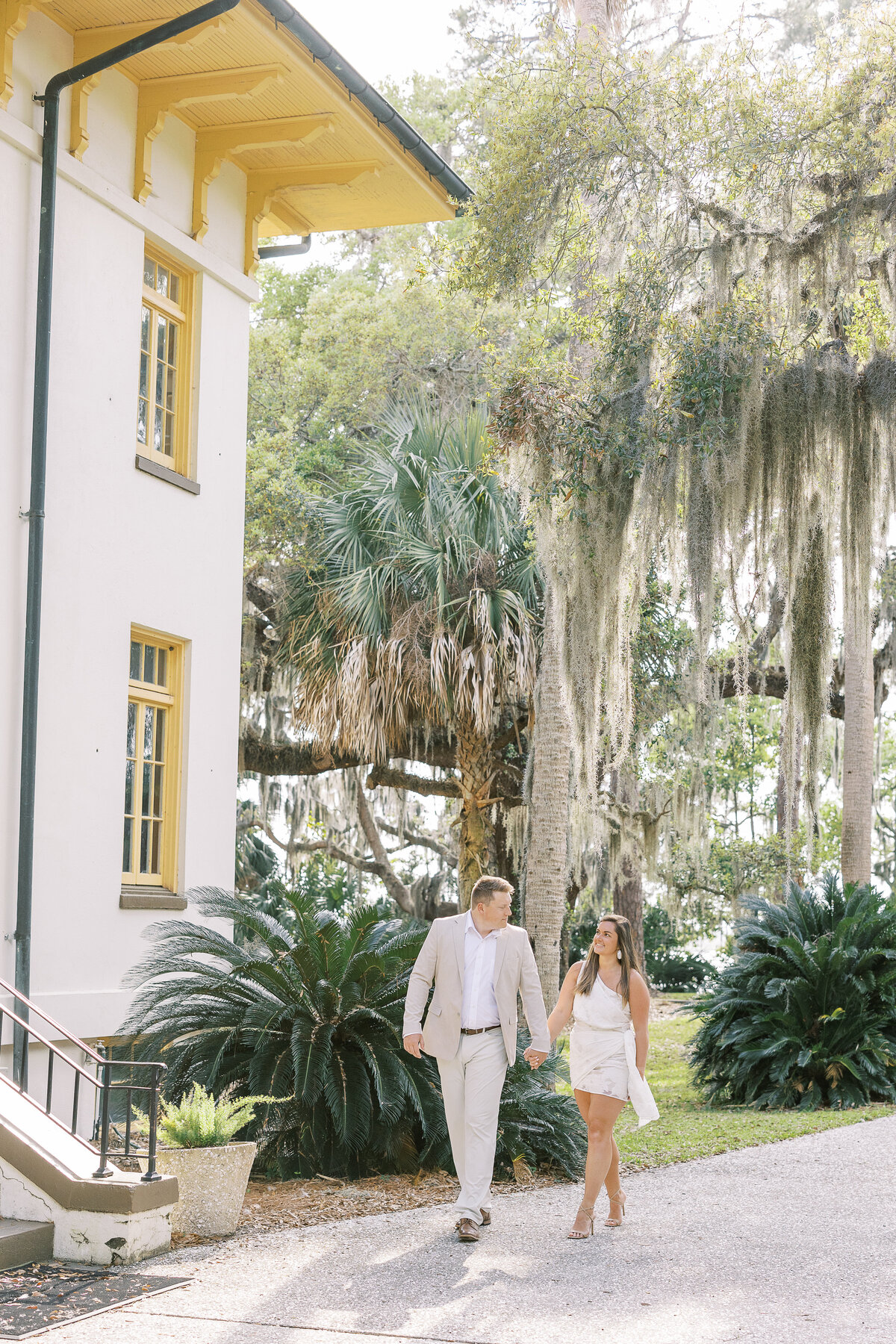 Couple walking under Savannah Oaks