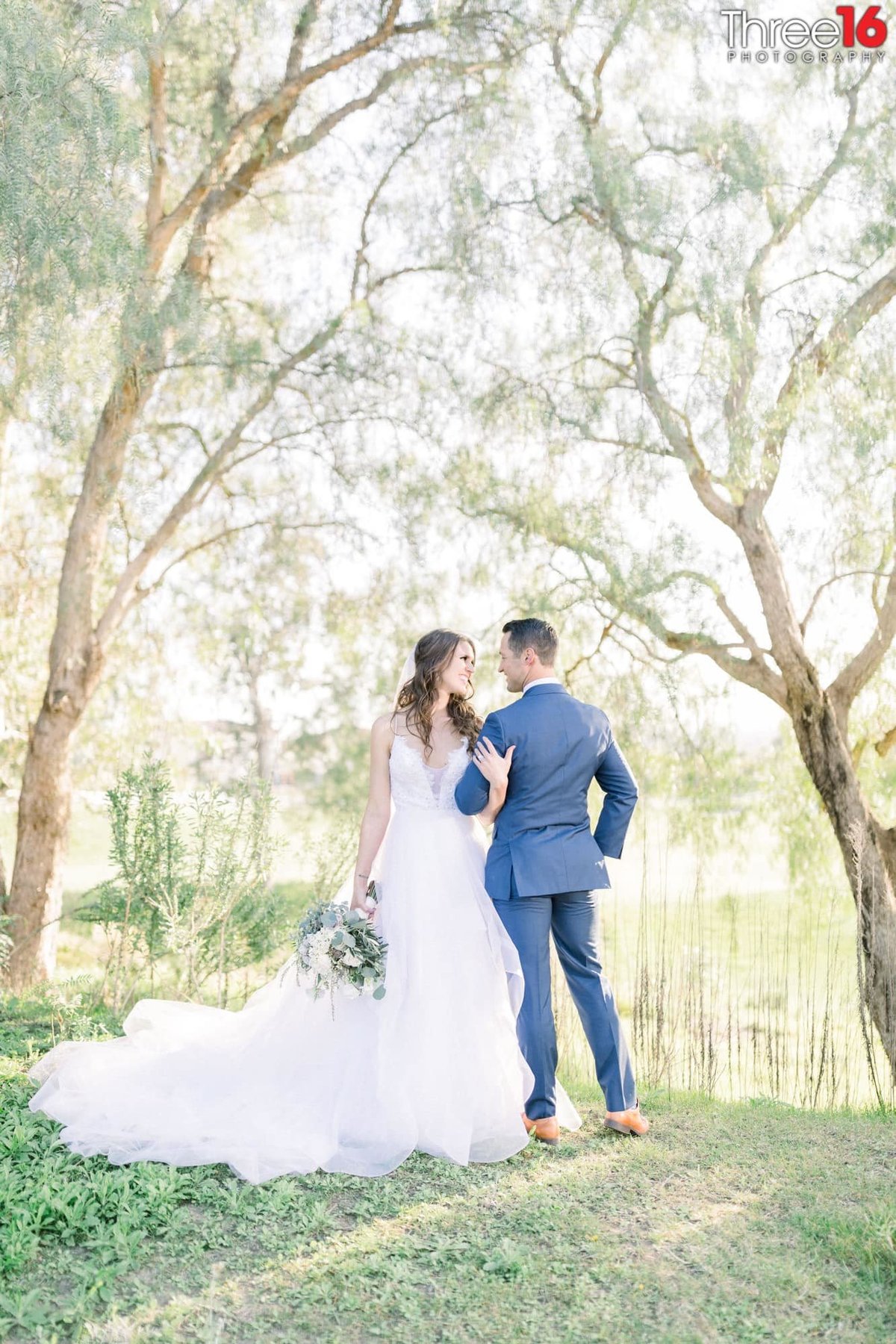 Bride and Groom are eye to eye while in the wood-like area in Yorba Linda, CA