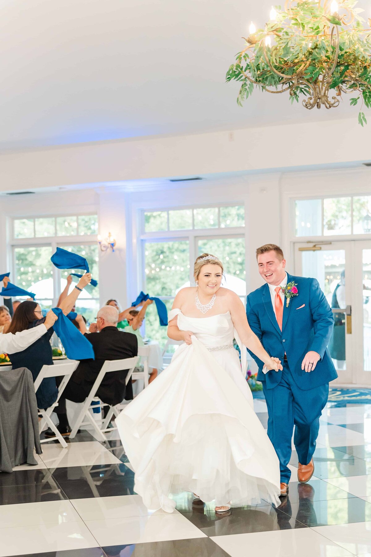 Bride and groom grand entrance at The Grande Victorian wedding venue in Monroe, NC