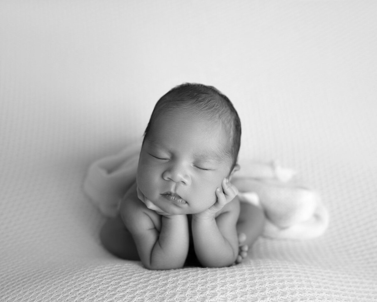Black white newborn chin on hands Georgetown classic pose photographer