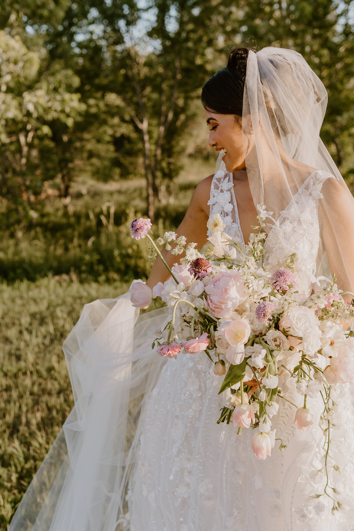 wedding-bridal-portrait-looking-down-emerald-hills-events-promise-city-iowa-des-moines-wedding-photographer-storyteller-collective-photo-co