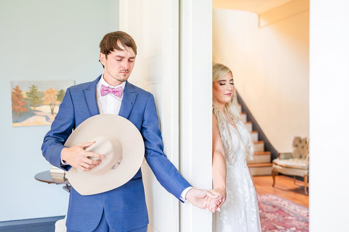 Bride and groom praying together at first touch  | Elms of Coosada Wedding Photographer 