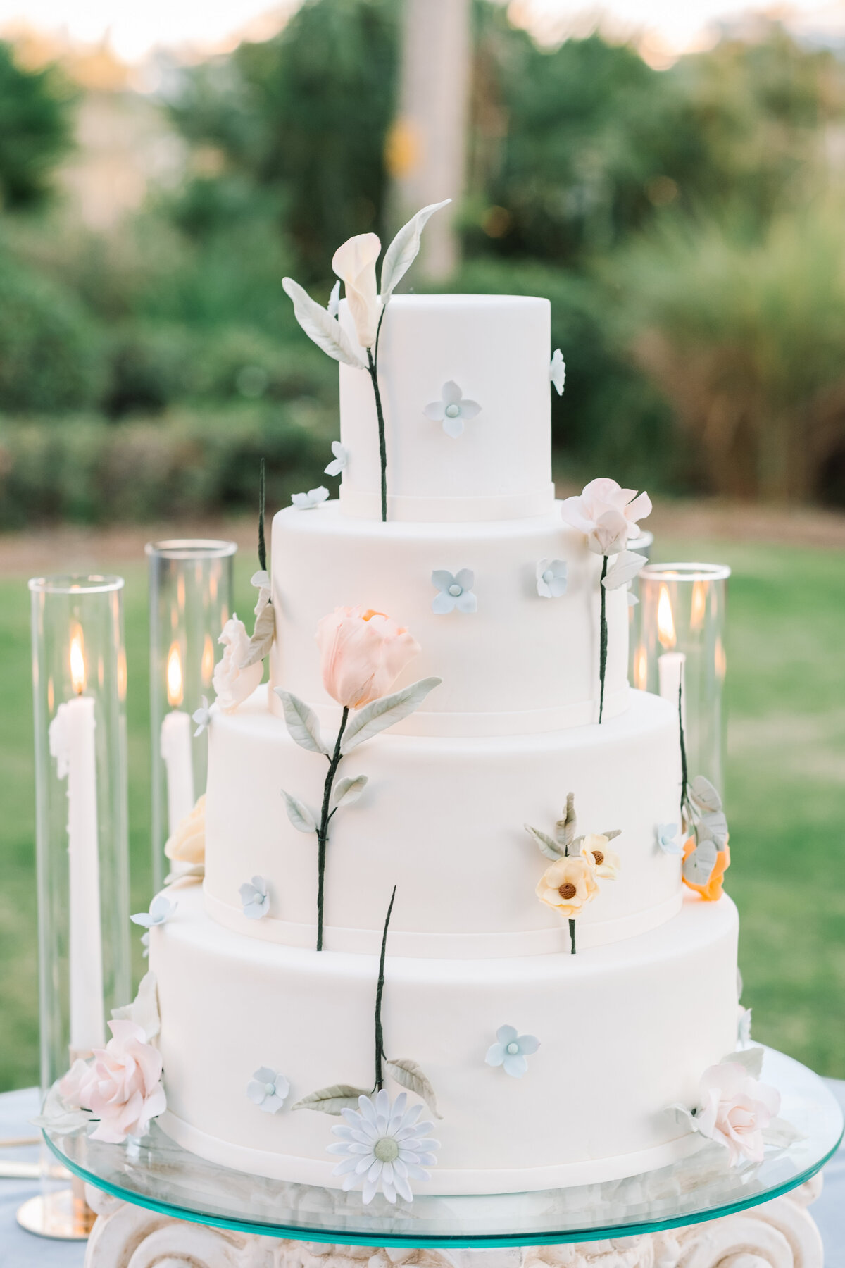 white-wedding-cake-pedestal-flowers