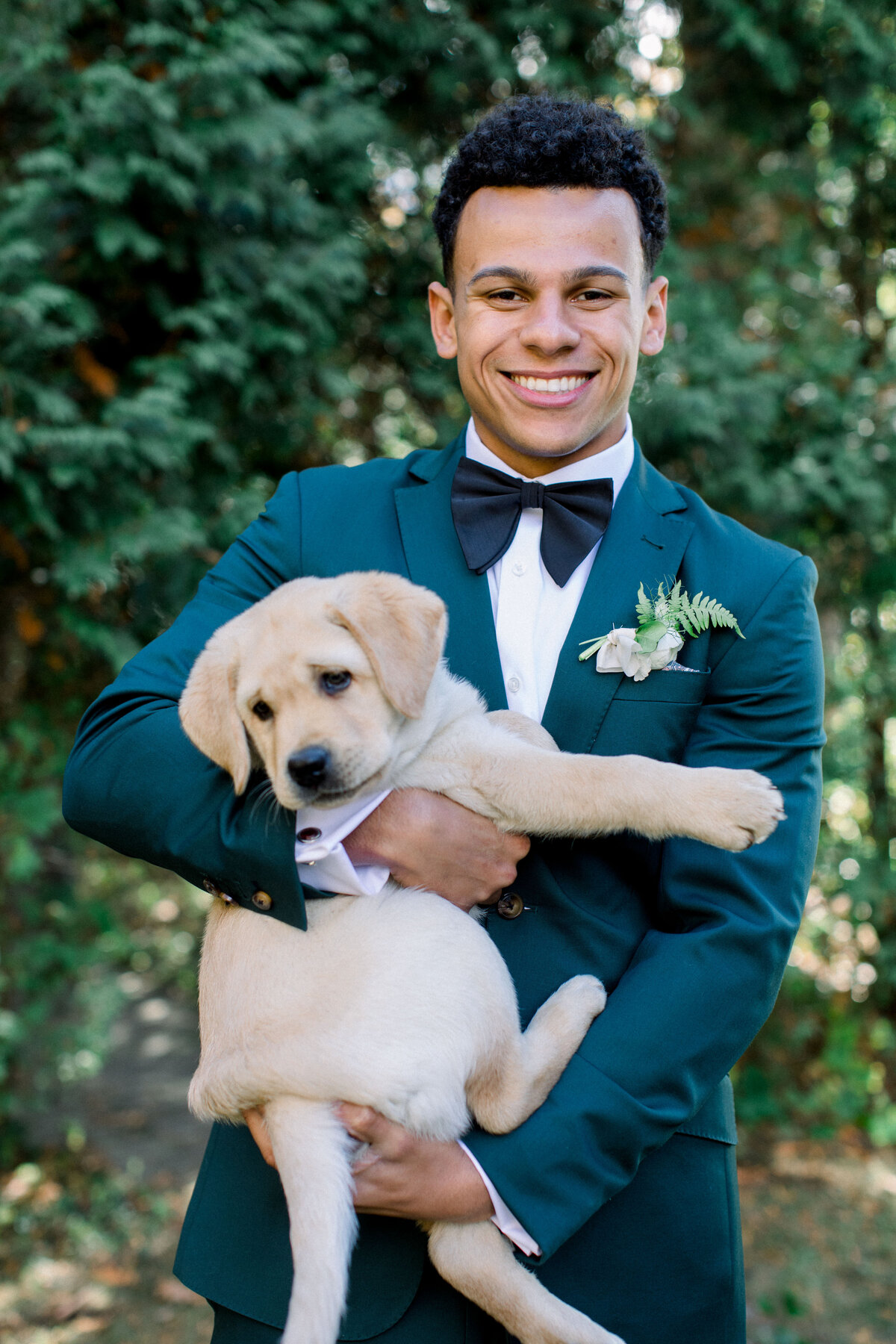 Groom with Golden Retriever Puppy