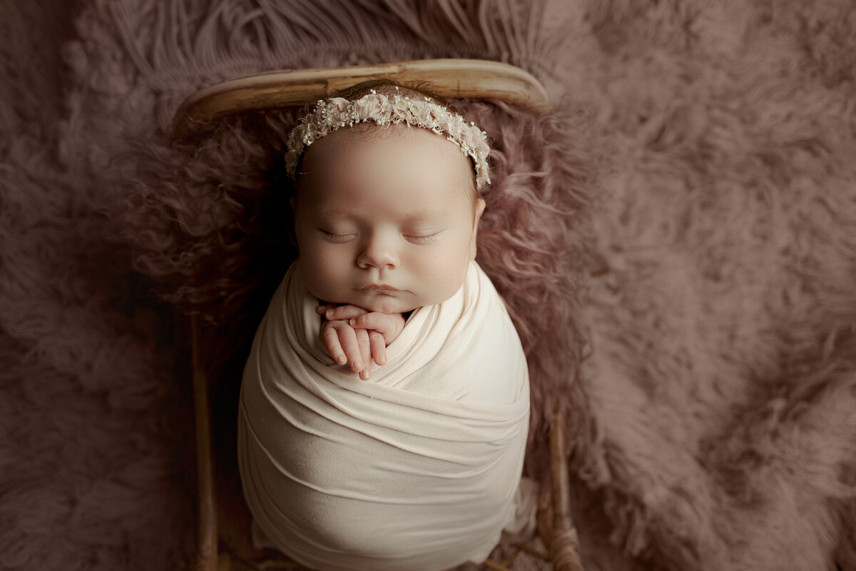 Professional newborn session with natural lighting and cozy styling in Austin