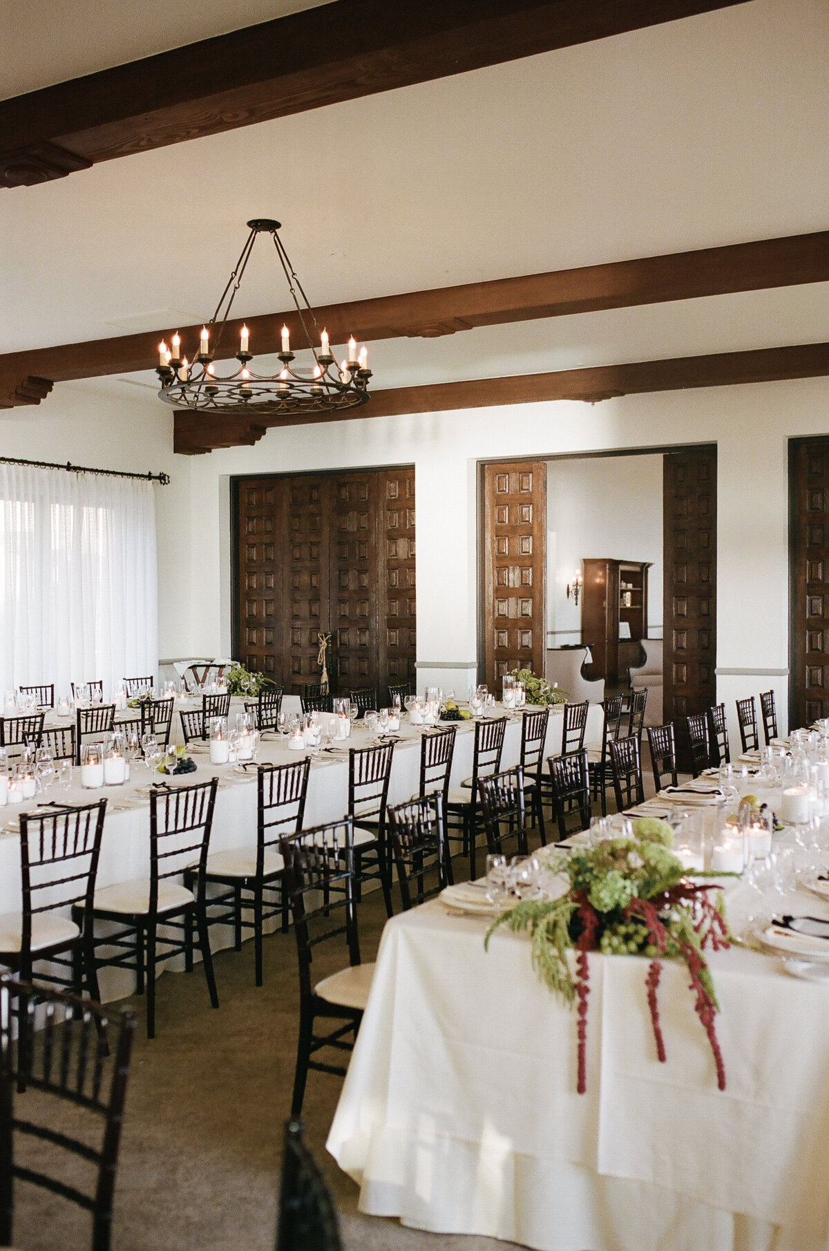 Vibrant floral centerpiece on a beautifully decorated table, creating a stunning atmosphere for a La Jolla wedding.
