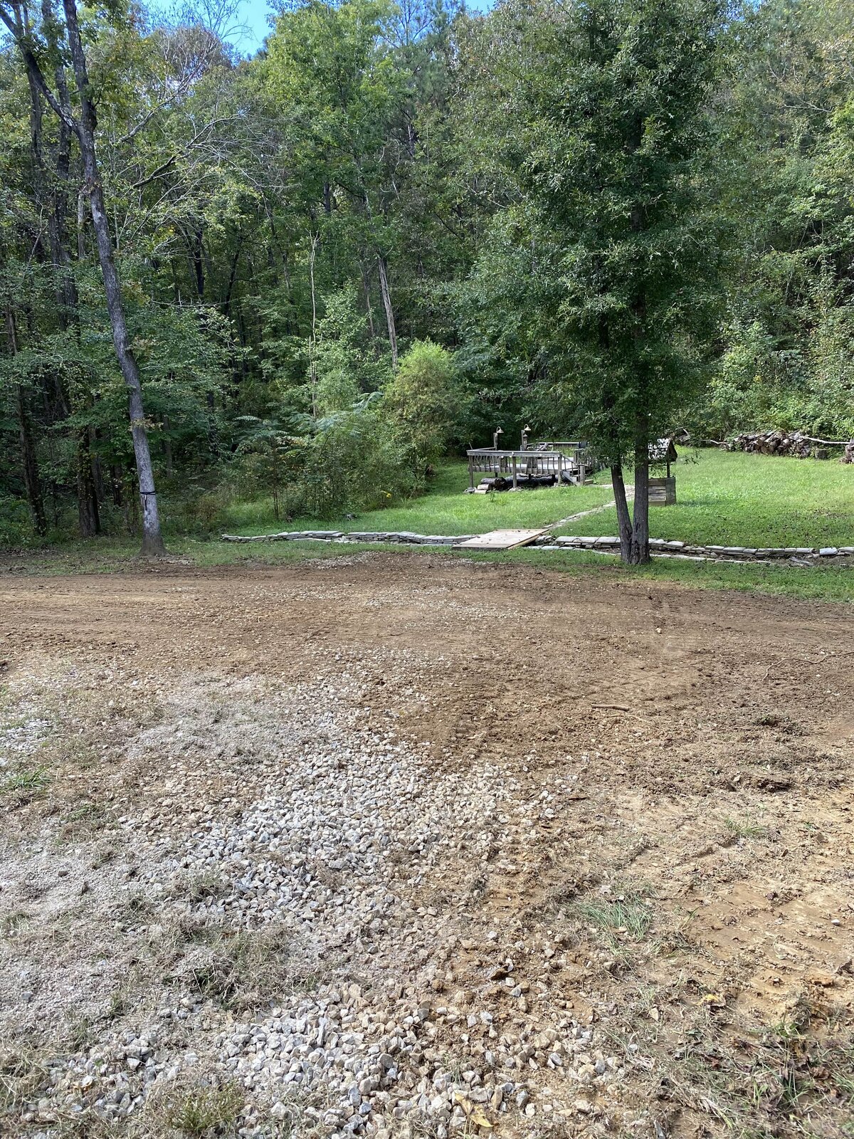 gravel-area-in-front-of-trees-and-grass