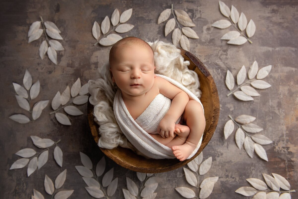 Best West Palm Beach newborn photographer captures newborn boy in neutral color scheme.