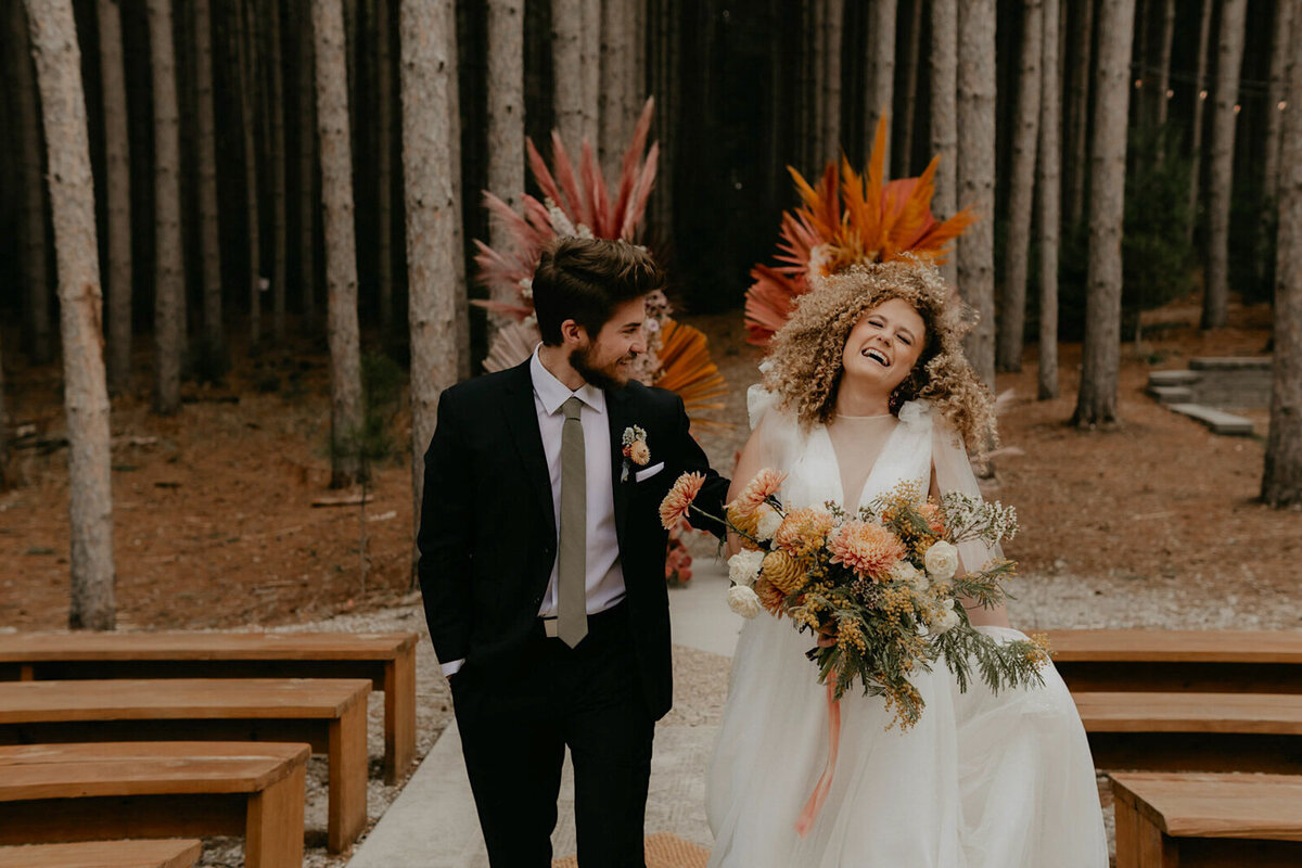 laughing-couple-forest-elopement-pinewood-weddings-and-events-cambridge-minnesota-des-moines-storyteller-collective-photo-co