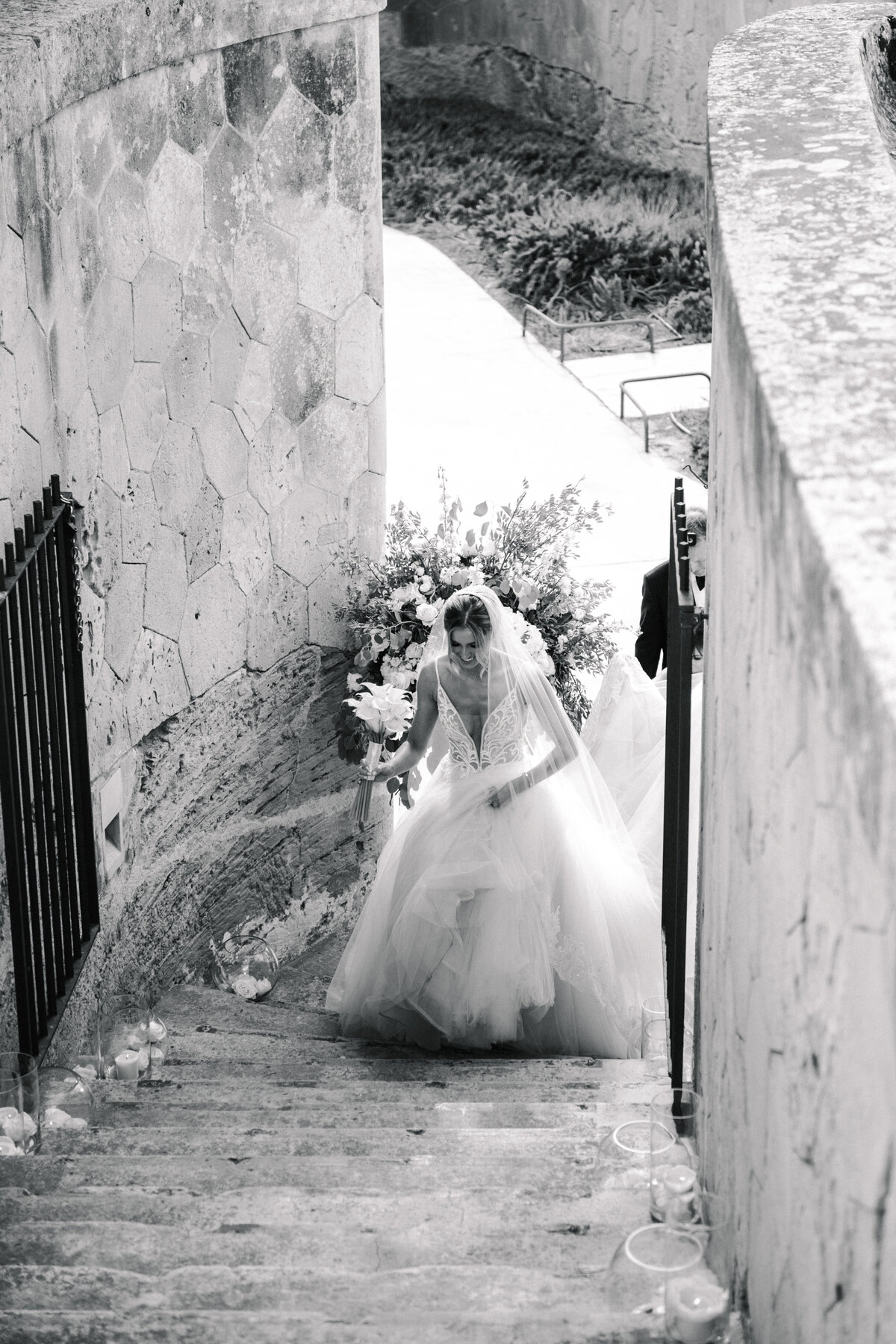 bride walking to wedding ceremony at cap rocat mallorca