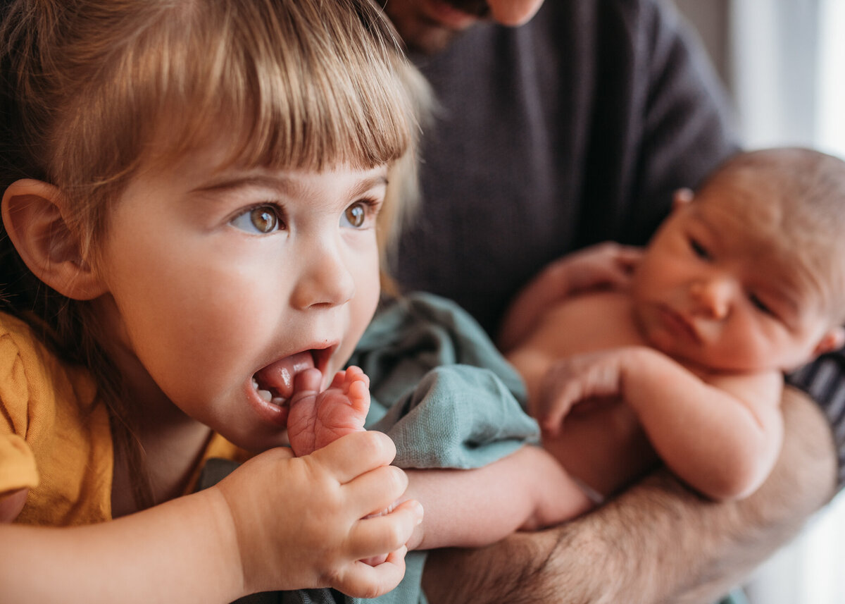 Sister-licking-baby's-toes-In-Home-Newborn-Photography-Megan Browne-Melbourne-Newborn-Photographer (22)