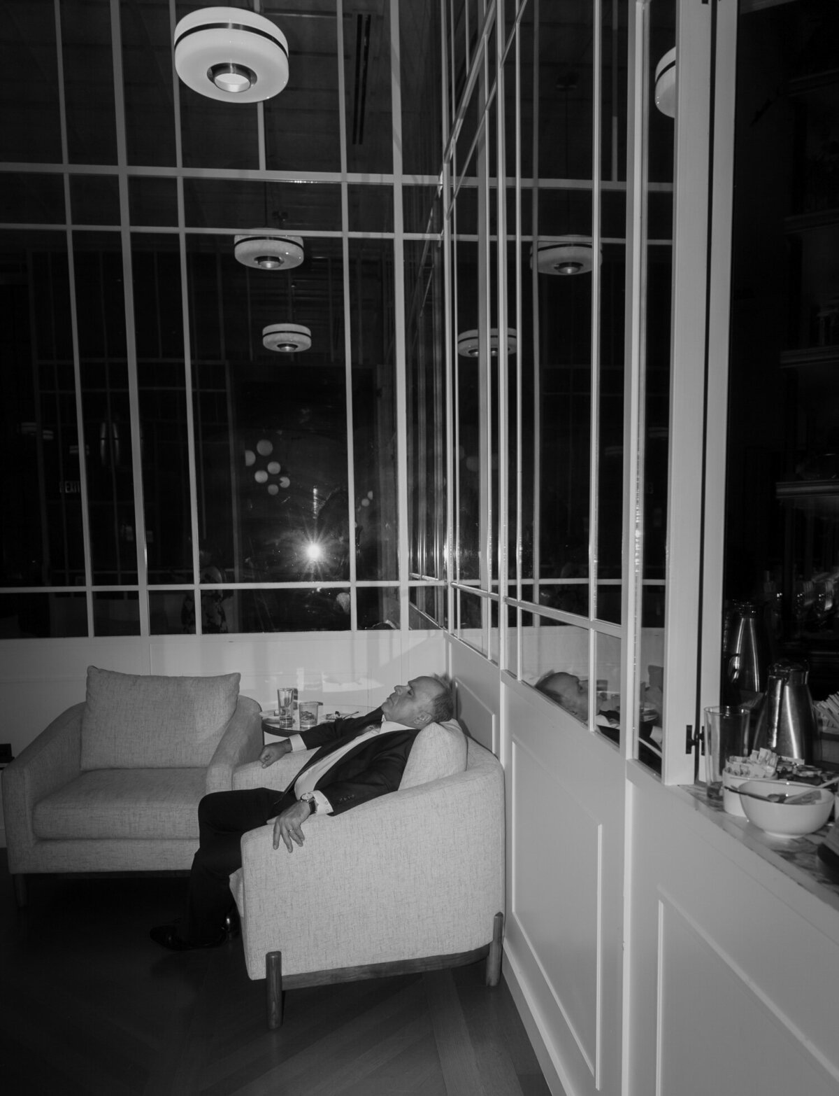 wedding guest sleeps in a chair during Shinola Hotel wedding reception