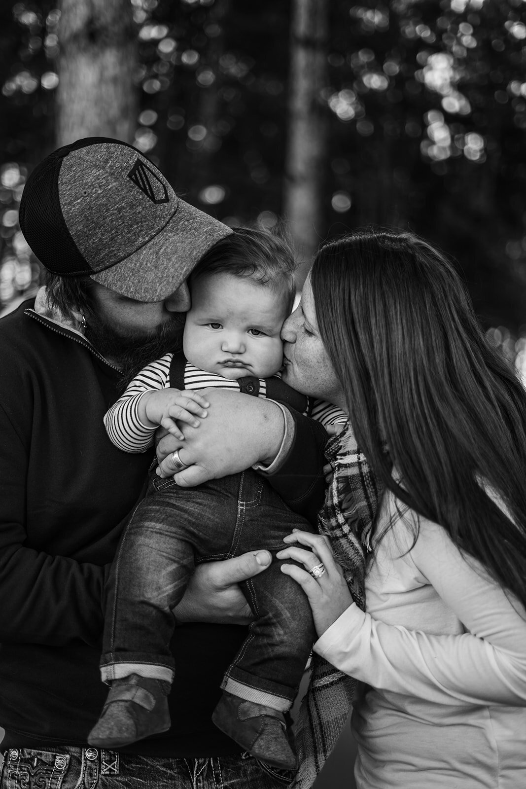 couple kissing child between them