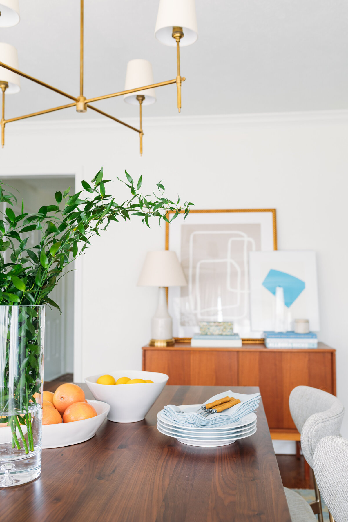 Wood dining table with greenery and fruit