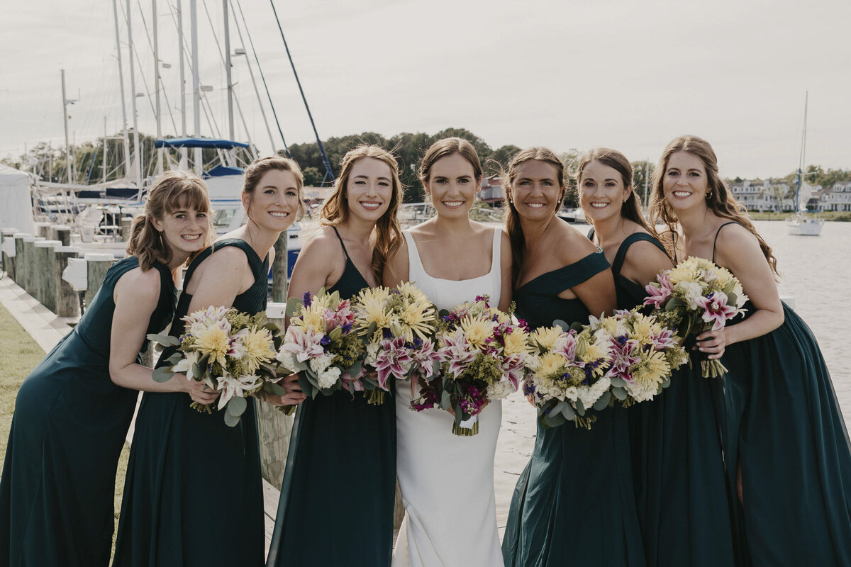 Bride with her bridesmaids outside