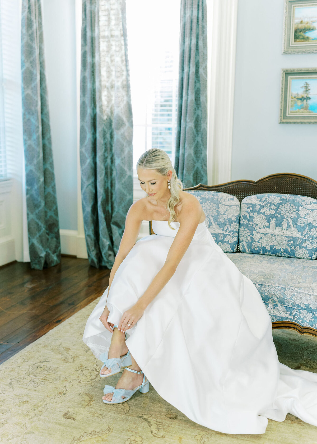 a bride putting on her shoes