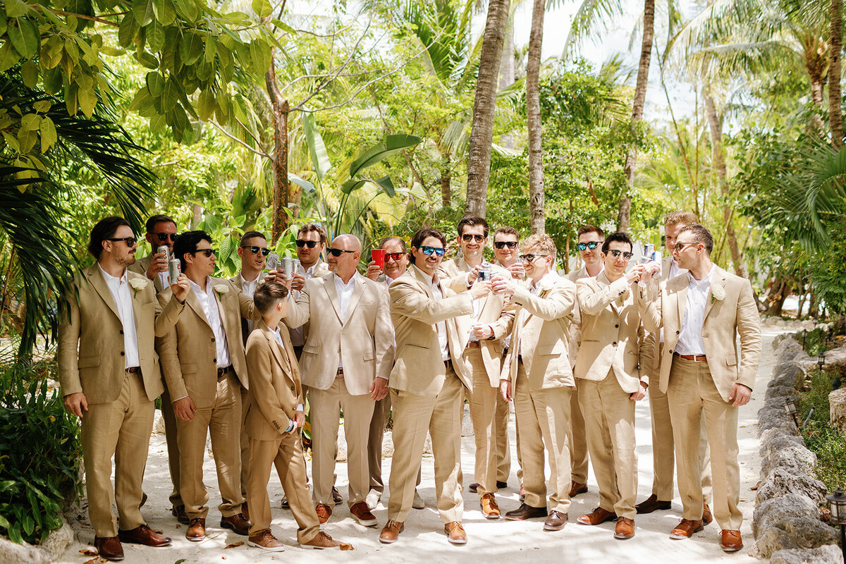 A fun, candid moment of Stephen with his groomsmen at Cheeca Lodge wedding venue.