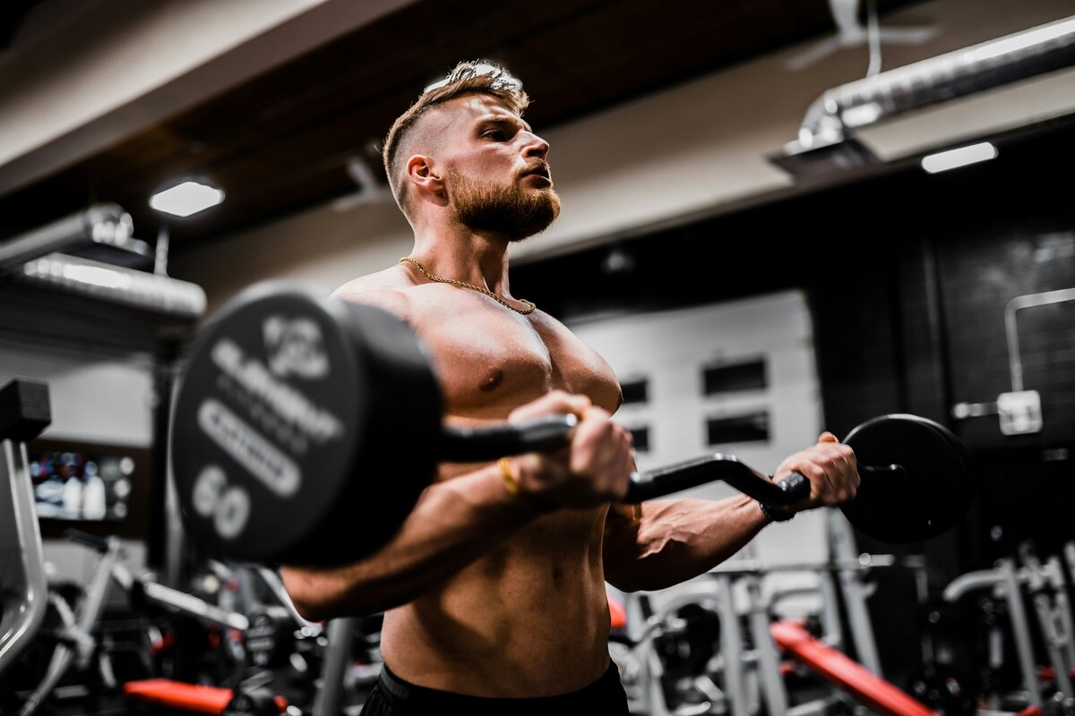 Man lifting heavy weights in a gym