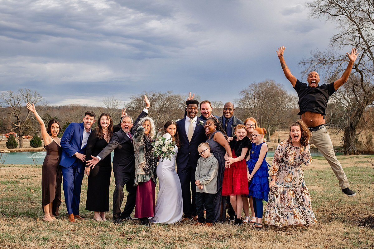 Group photo of everyone together outside during micro wedding, fun photo