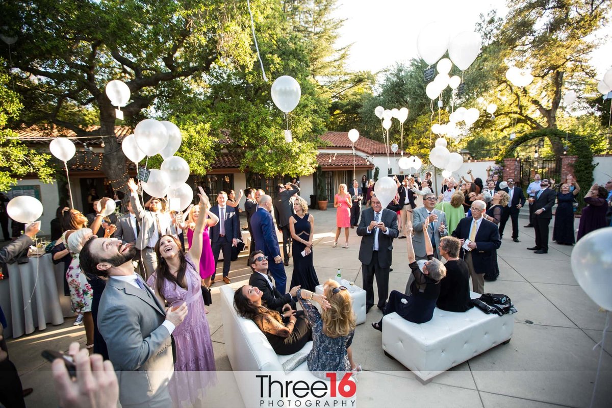 Balloons being released into the air after wedding ceremony