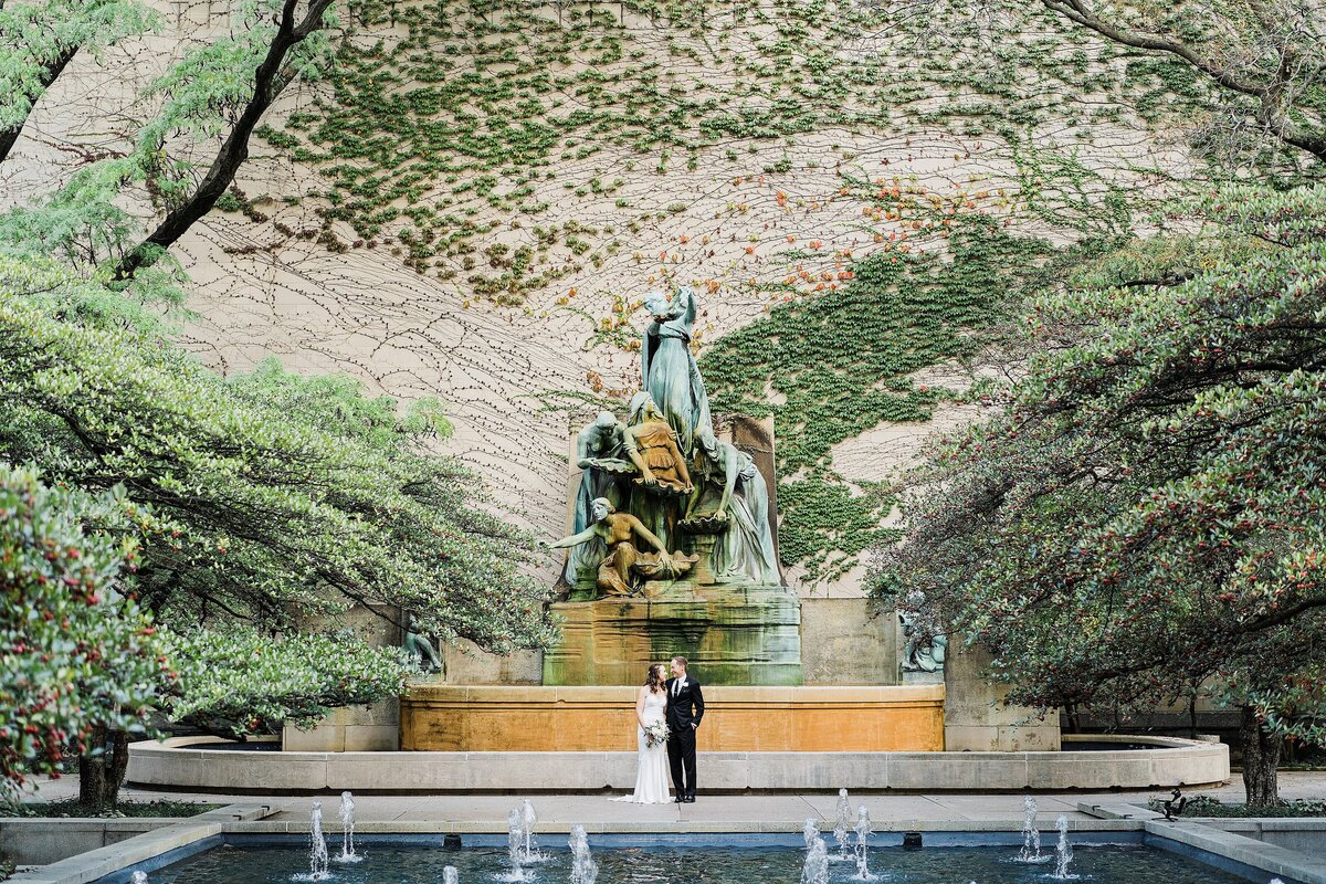 bride and groom at chicago art institute fountain