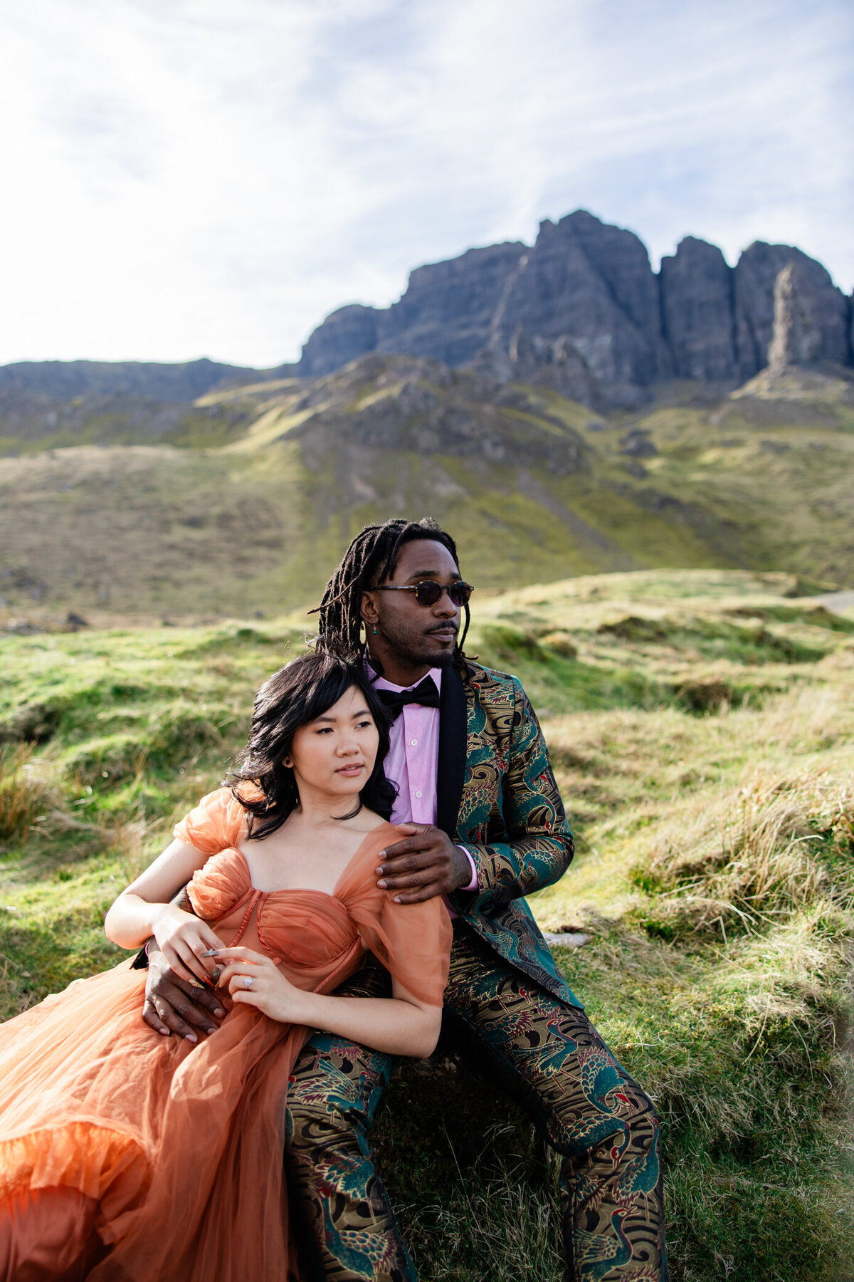 bride and groom hug in tall grass