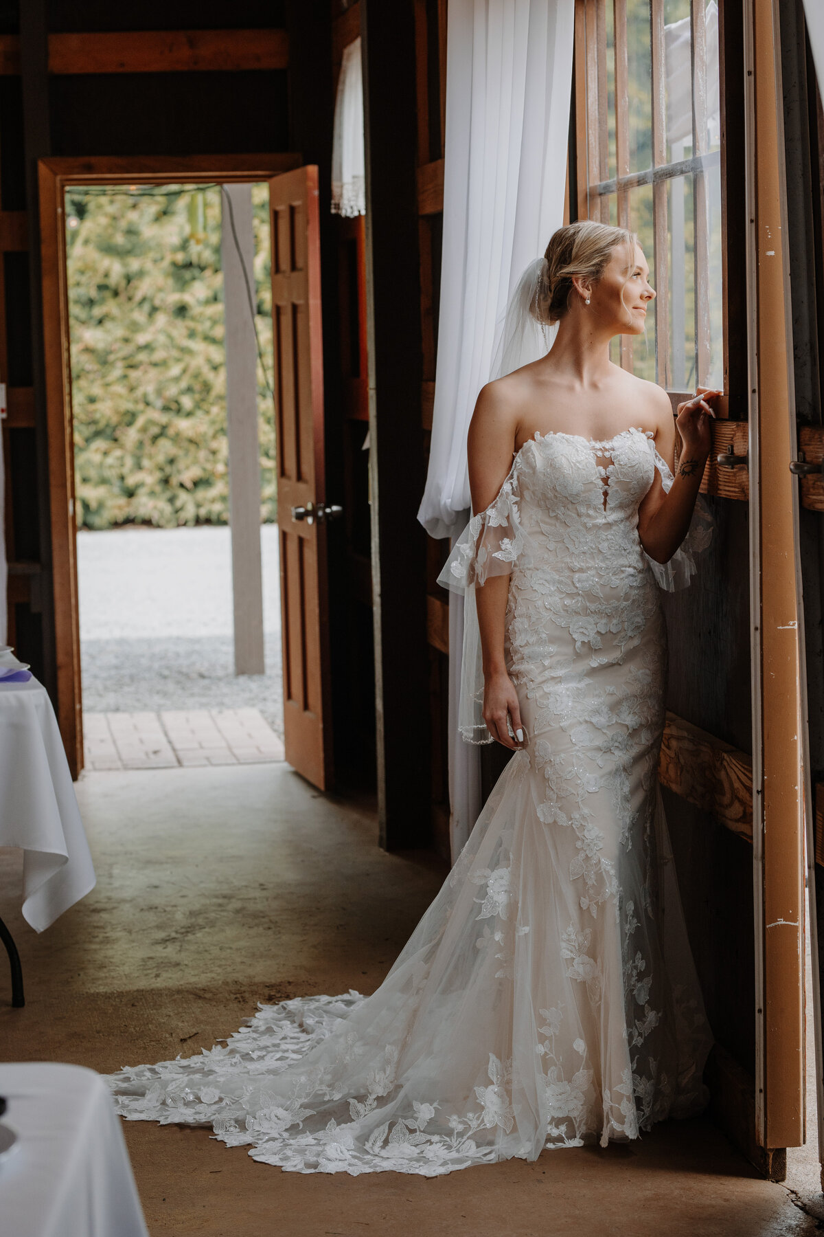 Bride inside looking out window